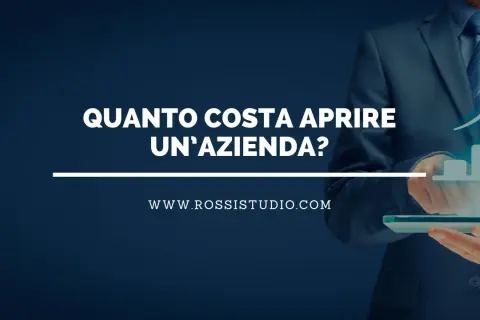 Scopri il costo apertura srl. Un uomo in giacca e cravatta analizza grafici di crescita su un tablet.
