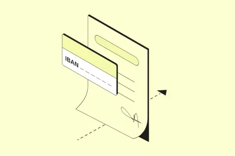Un documento con un IBAN e una carta. L'IBAN ha 27 caratteri, essenziali per le transazioni bancarie.