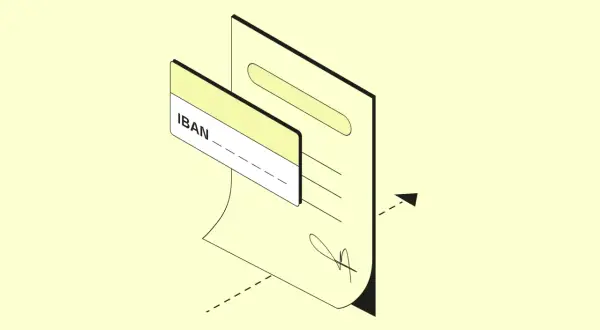 Un documento con un IBAN e una carta. L'IBAN ha 27 caratteri, essenziali per le transazioni bancarie.