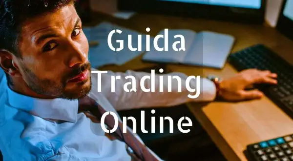 Uomo concentrato davanti a schermi, testo "Guida Trading Online".