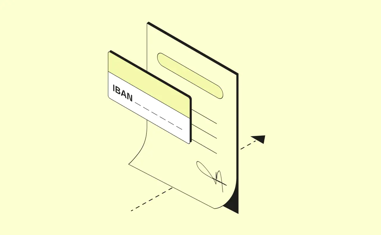 Un documento con un IBAN e una carta. L'IBAN ha 27 caratteri, essenziali per le transazioni bancarie.